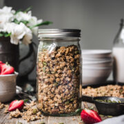 side view of gluten free granola in glass jar