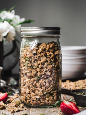 side view of gluten free granola in glass jar