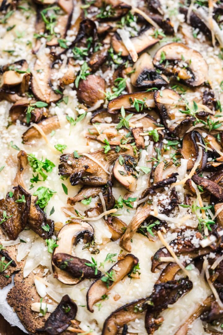 close up of wild mushrooms on pizza