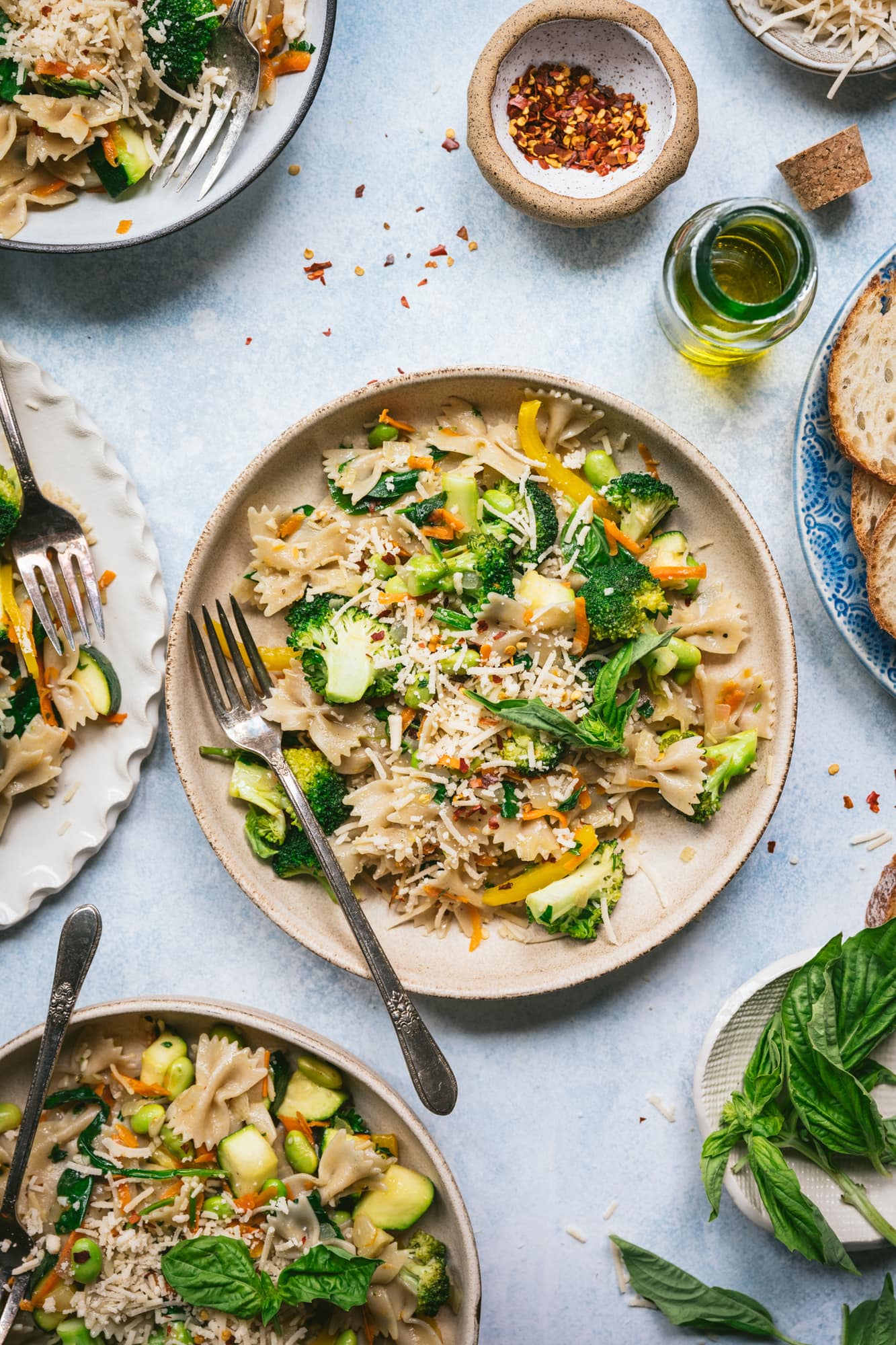 overhead view of vegan pasta primavera in a bowl with fork 