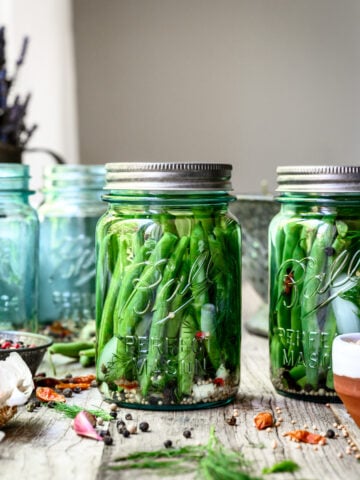 pickled dilly beans in blue ball jar