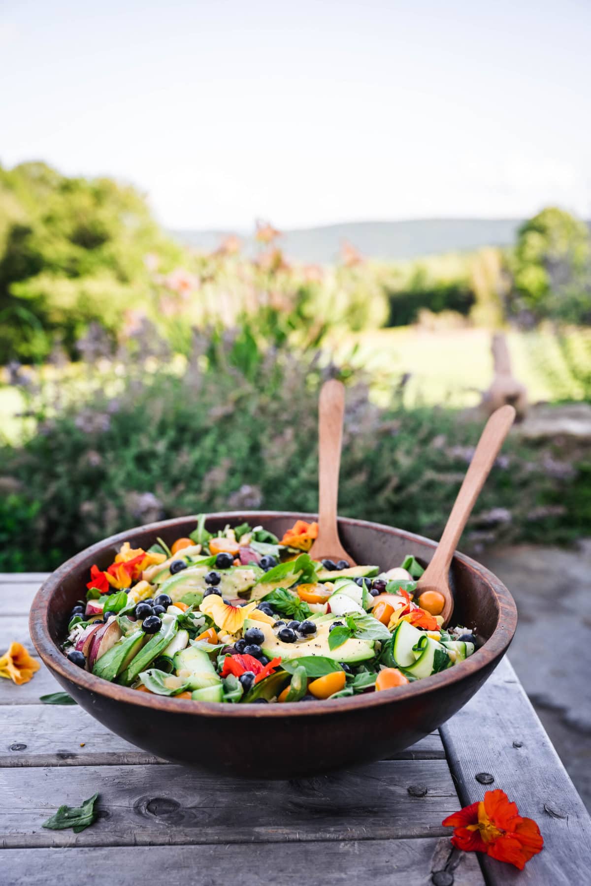 side view of summer dinner salad on outdoor table