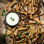 overhead view of crispy homemade fries on parchment paper