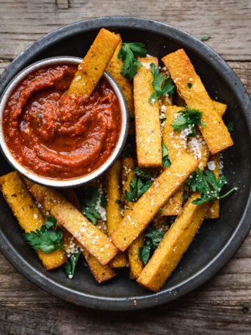 overhead view of polenta fries with marinara