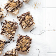 Smores from above with chocolate drizzled on top of them.