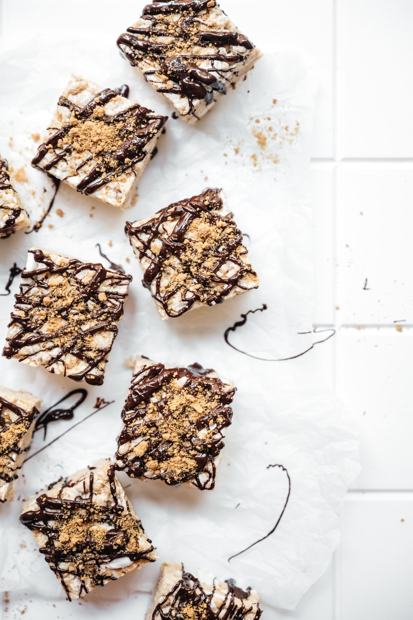 overhead view of vegan s'mores rice krispie treats on white backdrop