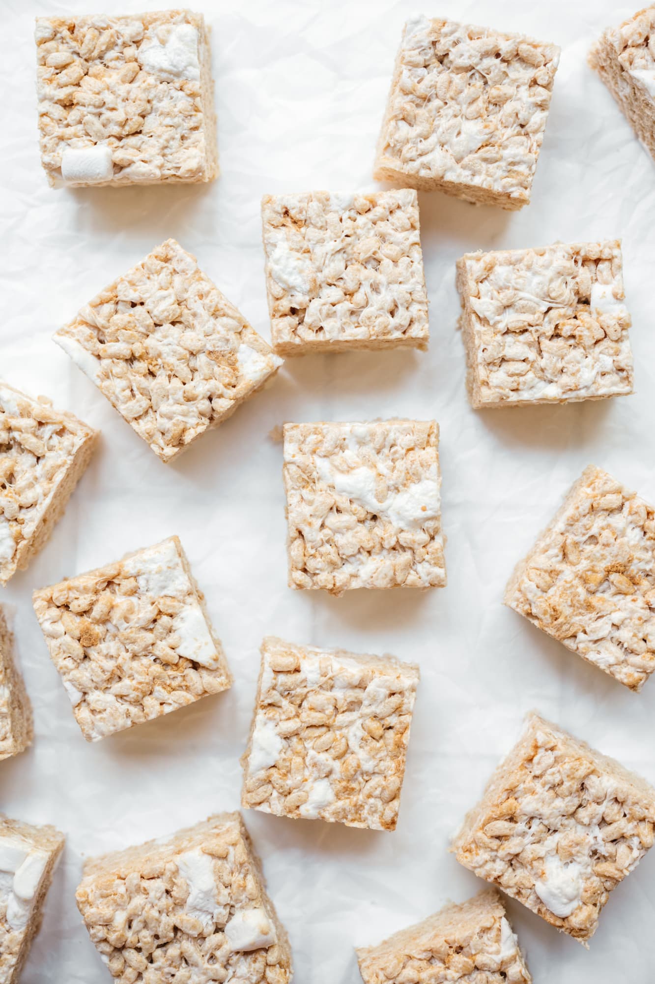 overhead view of plain vegan rice krispie treats on parchment paper