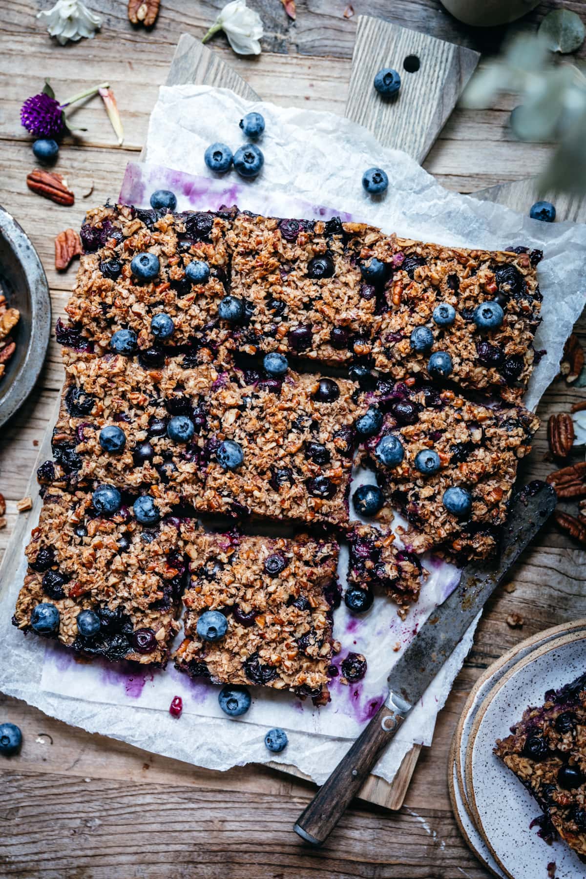 overhead view of vegan blueberry baked oatmeal on wood cutting board