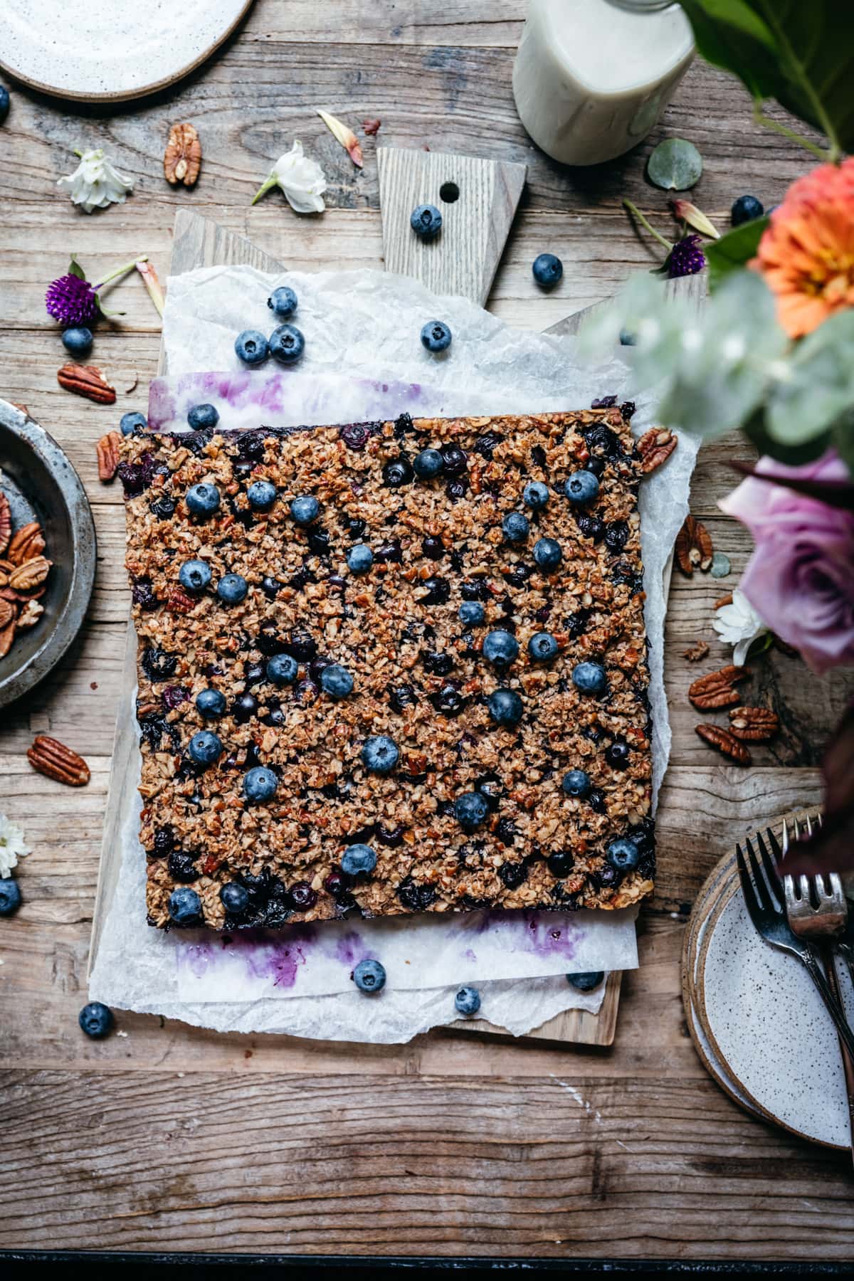 overhead view of vegan blueberry baked oatmeal on wood cutting board