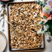 overhead view of vegan lemon blueberry coconut granola on a sheet pan