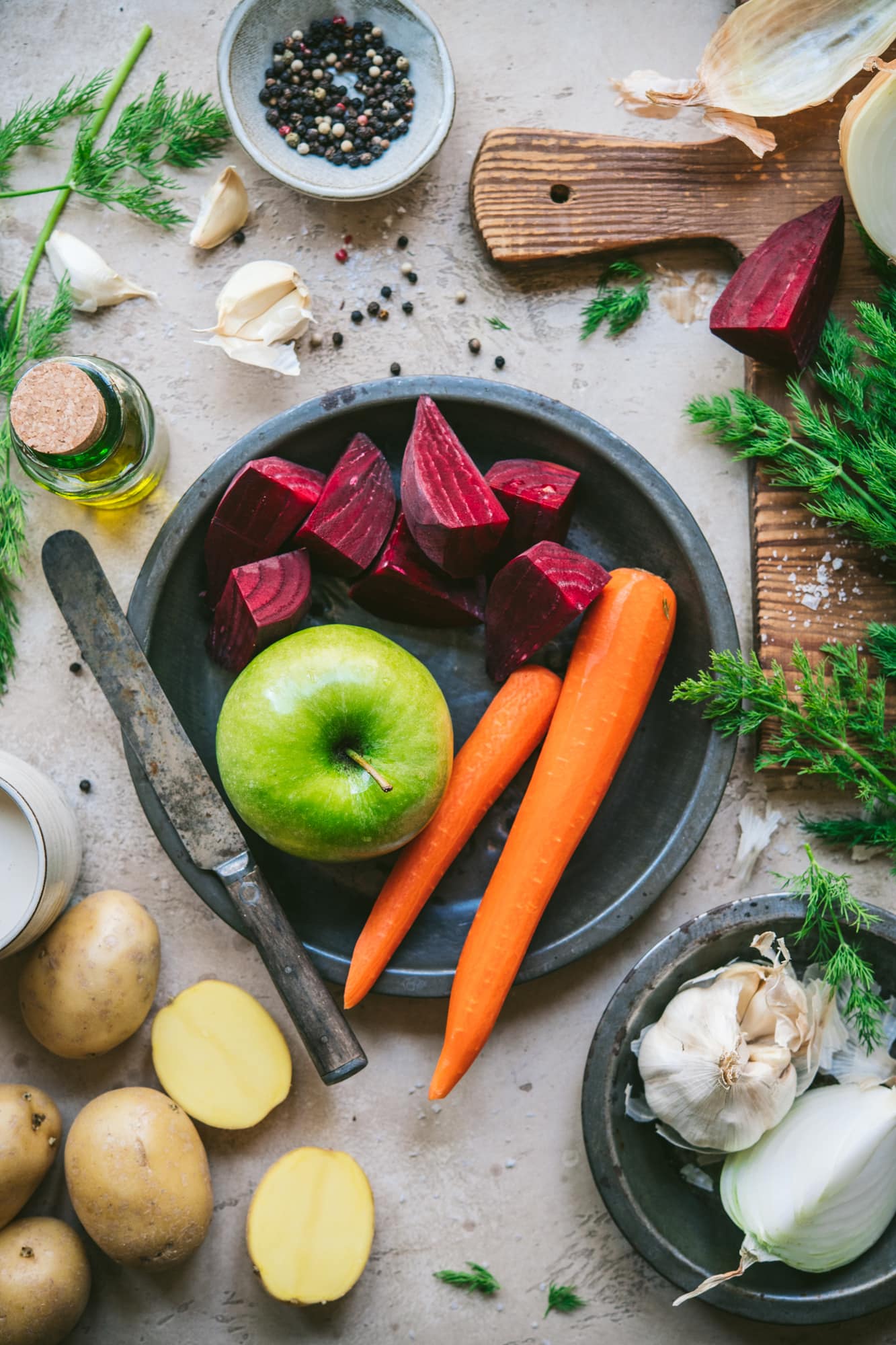 overhead view of ingredients for roasted beet, potato and carrot soup