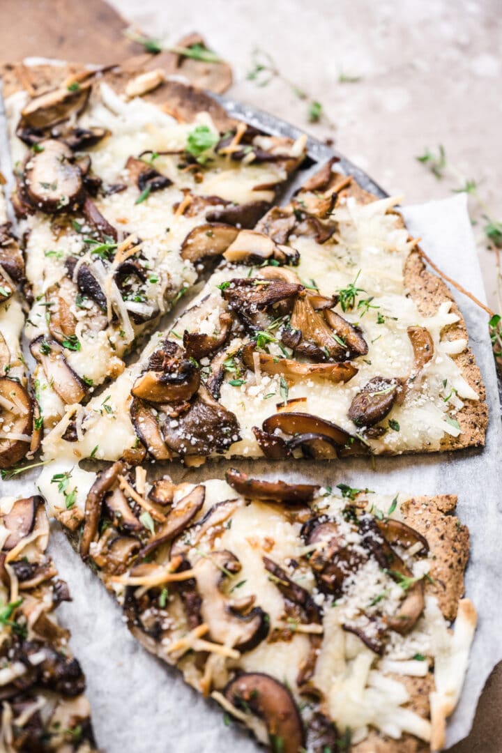 side view of slice of vegan mushroom pizza