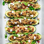 overhead view of quinoa stuffed zucchini boats in pan