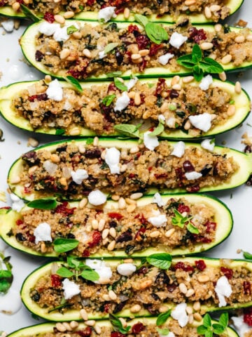 overhead view of quinoa stuffed zucchini boats in pan