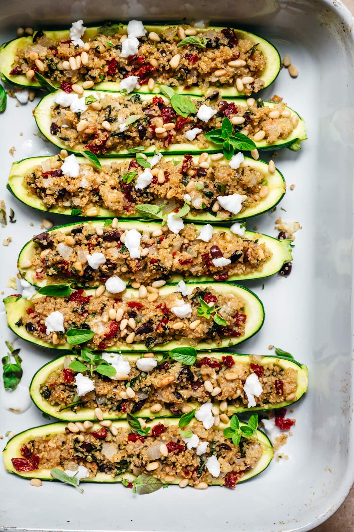 overhead view of quinoa stuffed zucchini boats in pan