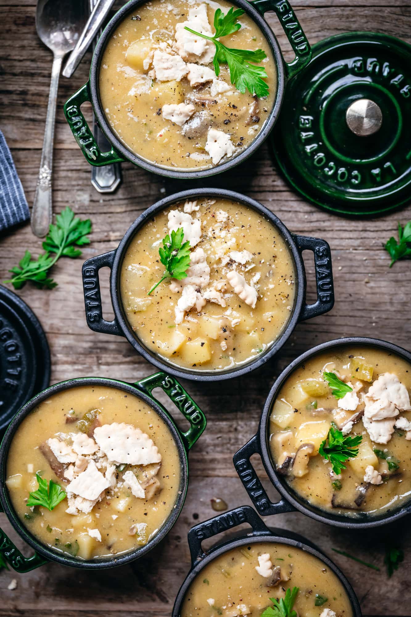 overhead view of vegan clam chowder in small cocottes