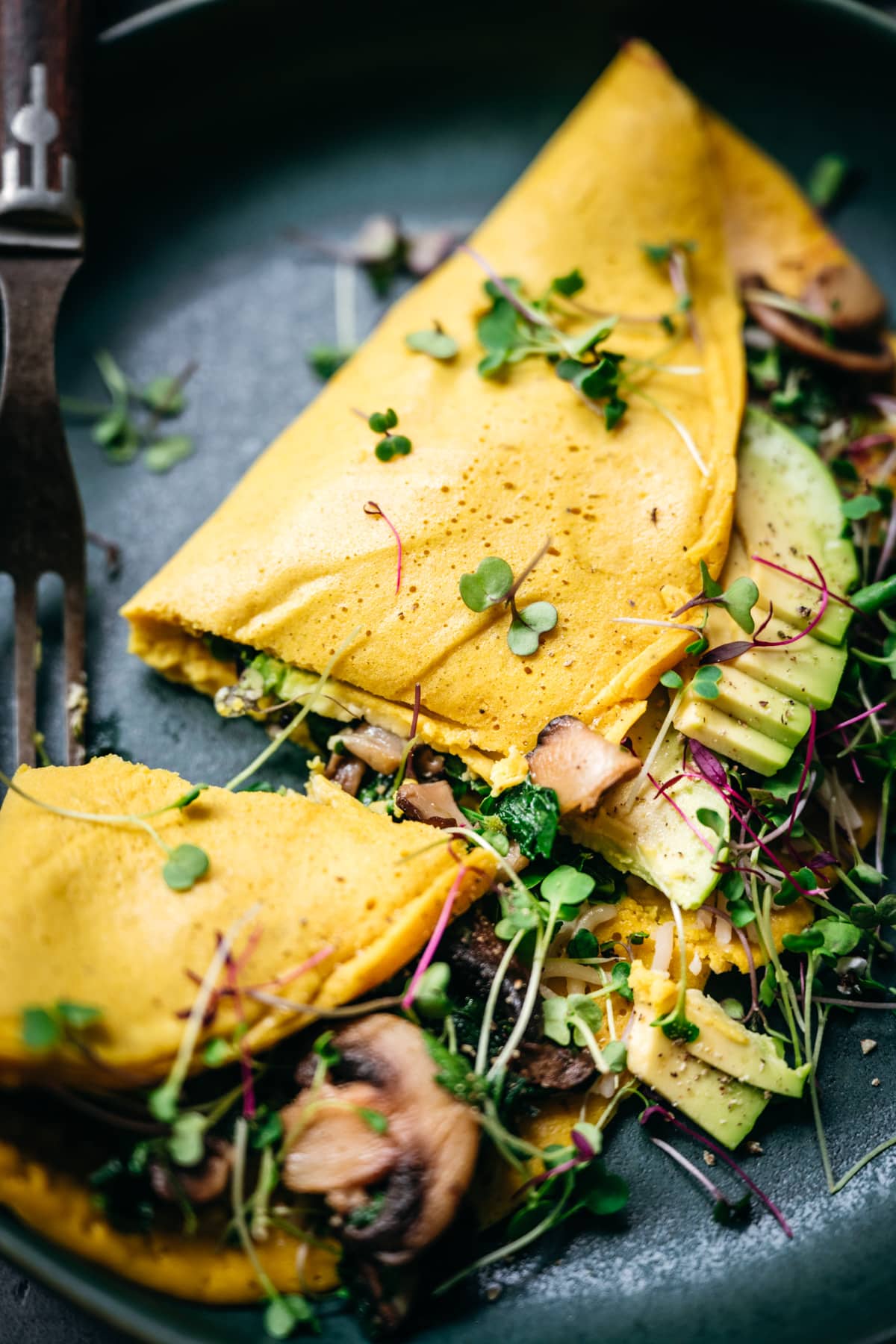 close up view of vegan omelette cut in half.