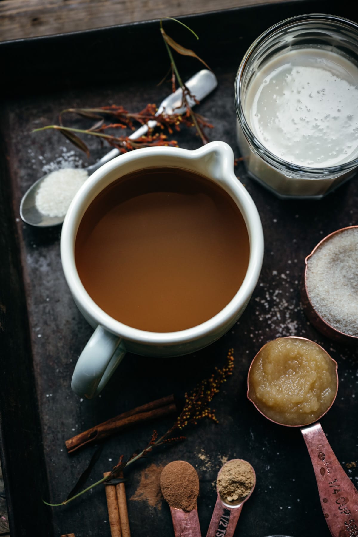 overhead view of a pitcher filled with apple cider.
