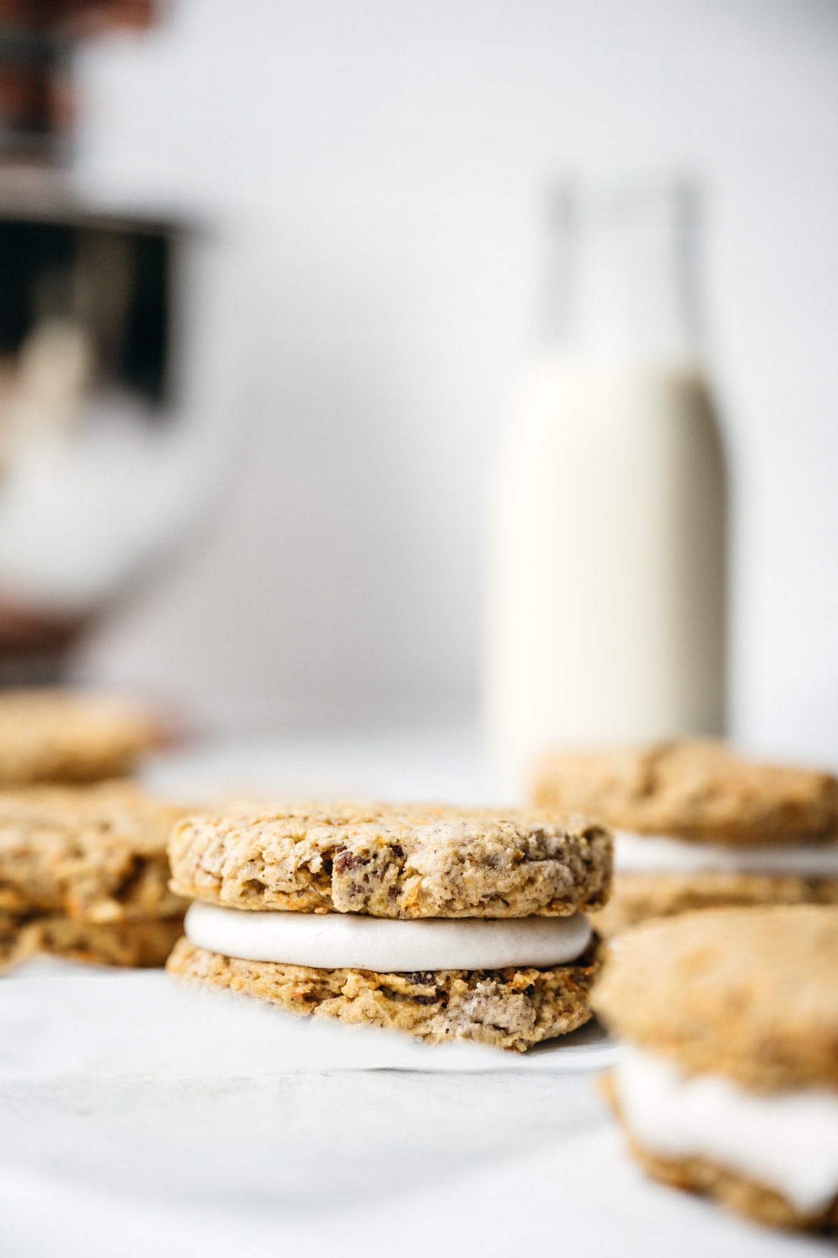 close up side view of vegan and gluten free carrot cake sandwich cookie.
