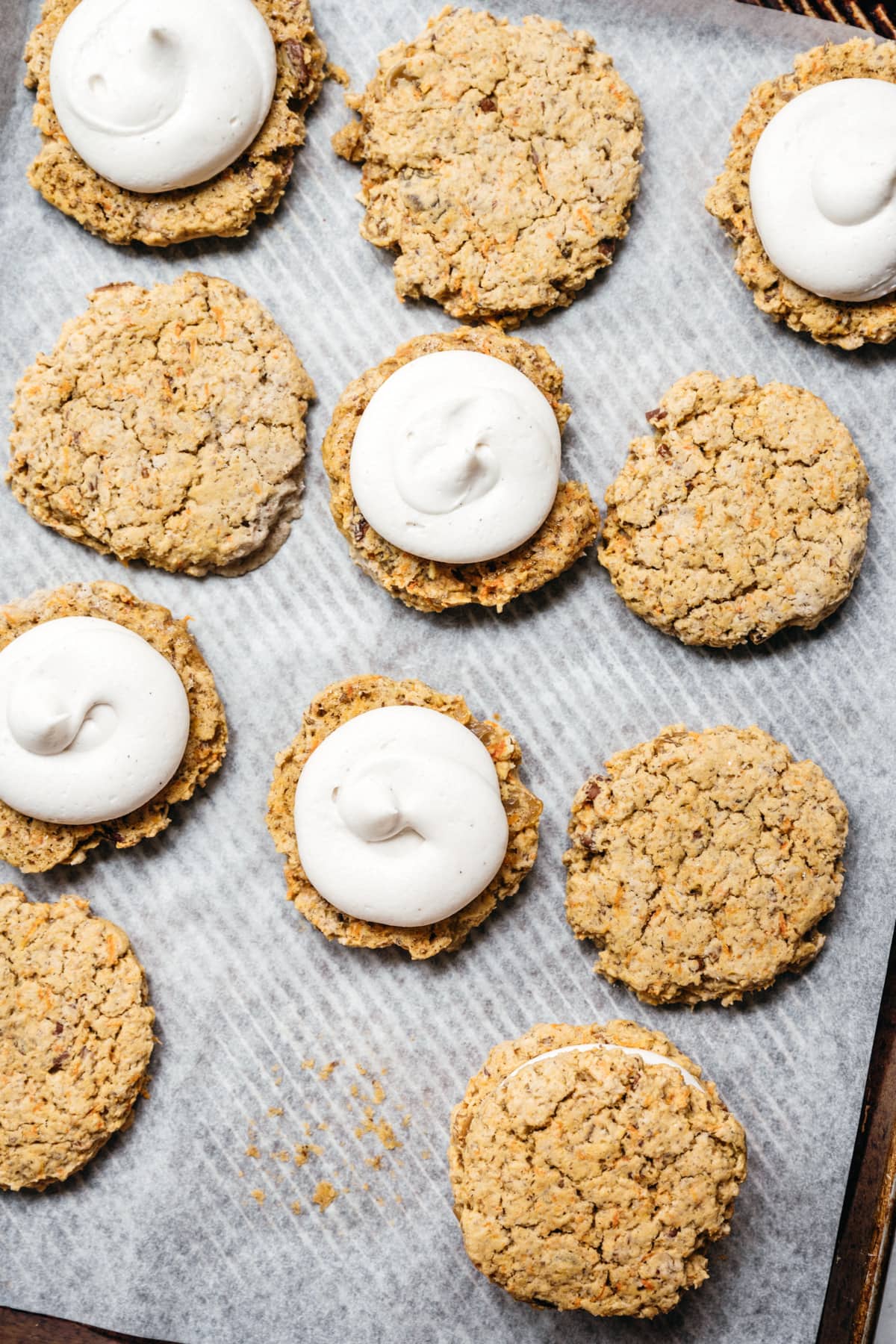 overhead view of carrot cake cookies on baking sheet.