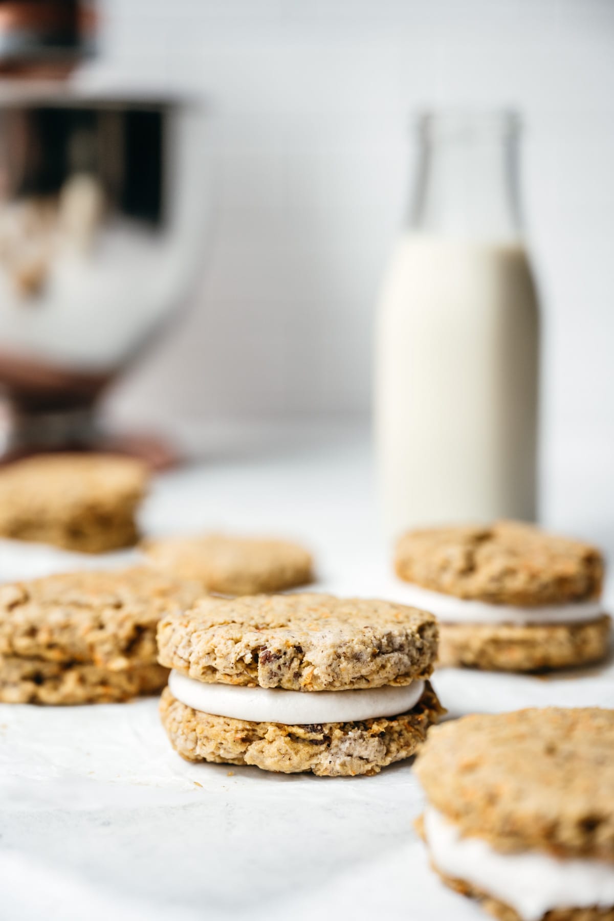 close up side view of vegan and gluten free carrot cake sandwich cookie.