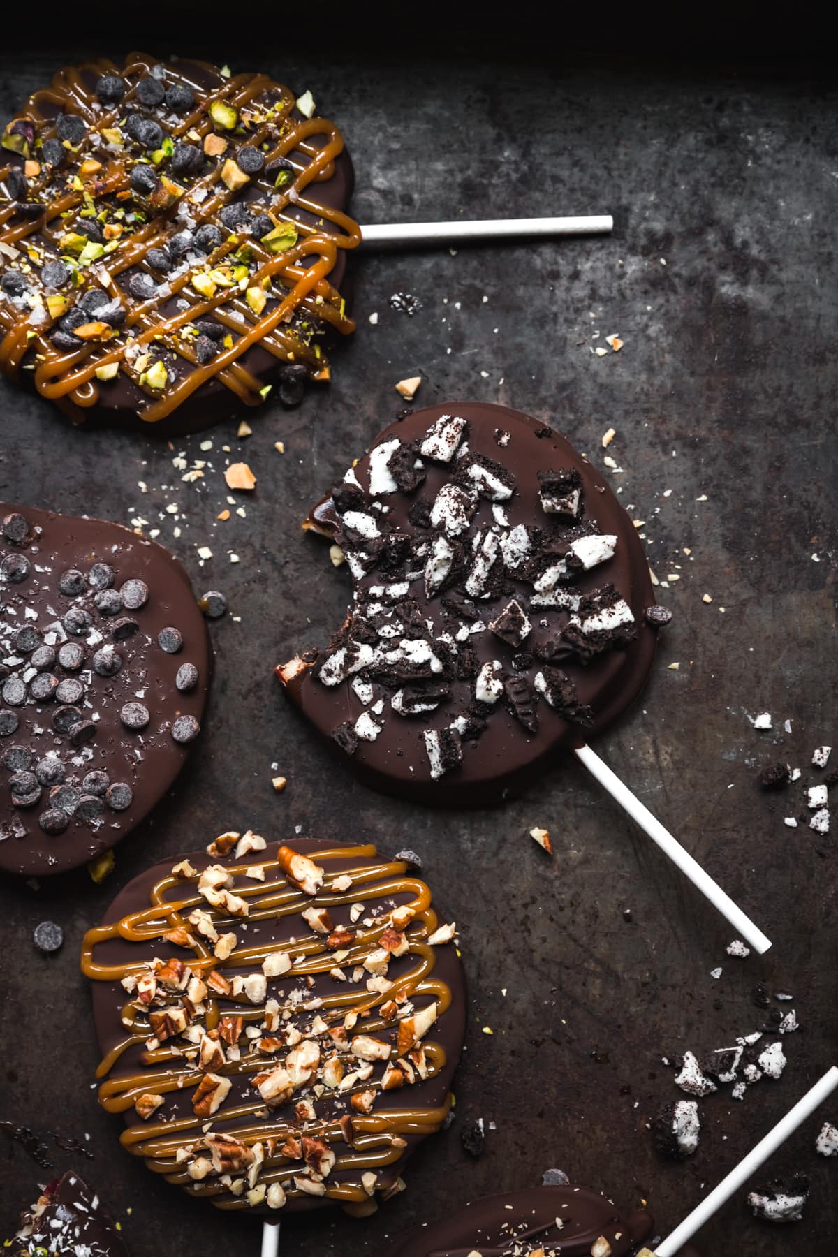 chocolate covered apple with crushed oreos with a bite taken out.