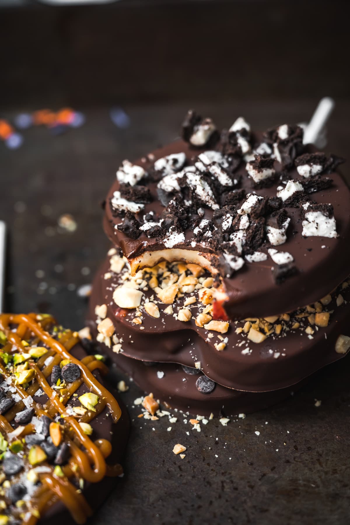 close up view of a stack of chocolate covered apple slices. 