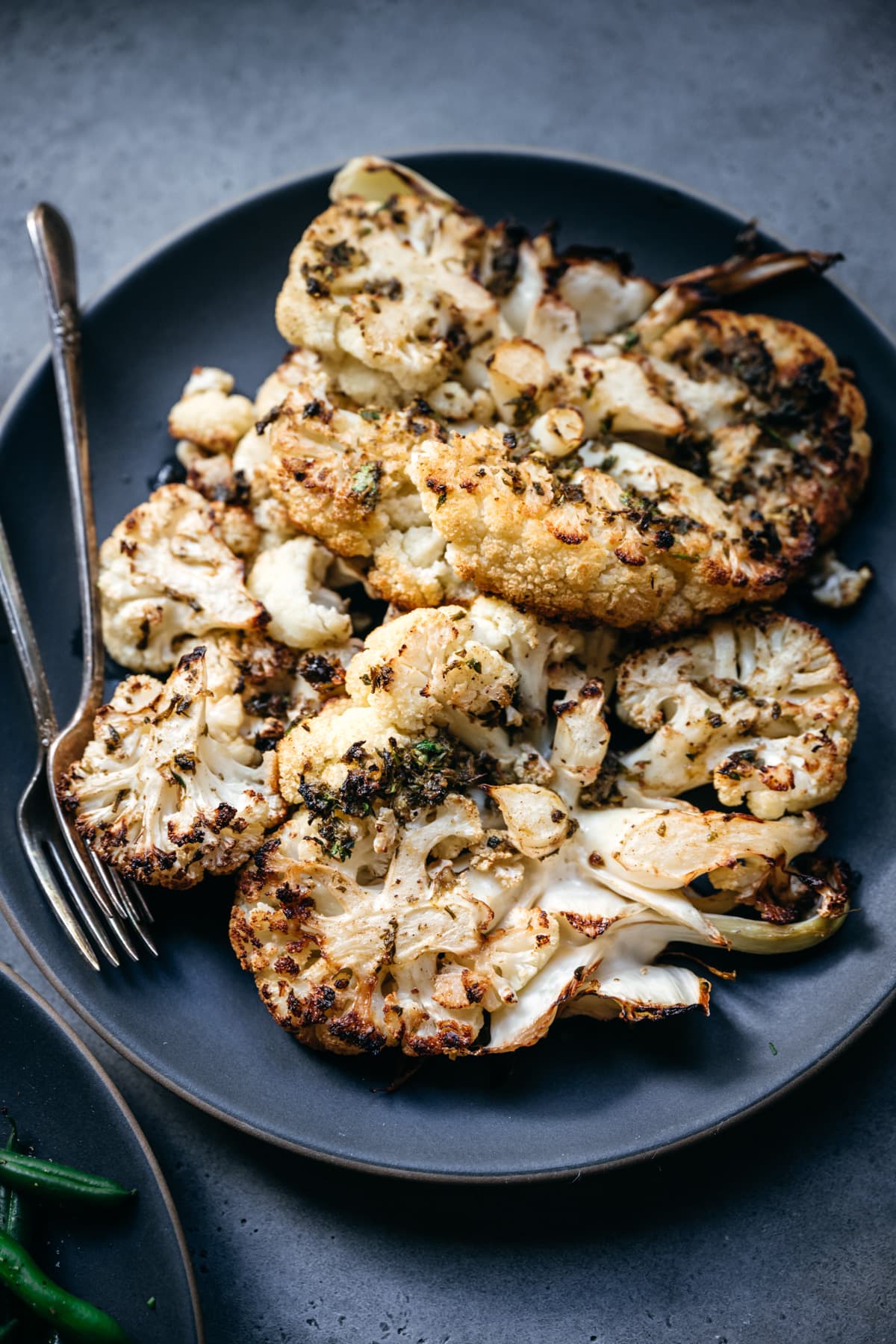 close up view of plate of roasted cauliflower florets. 