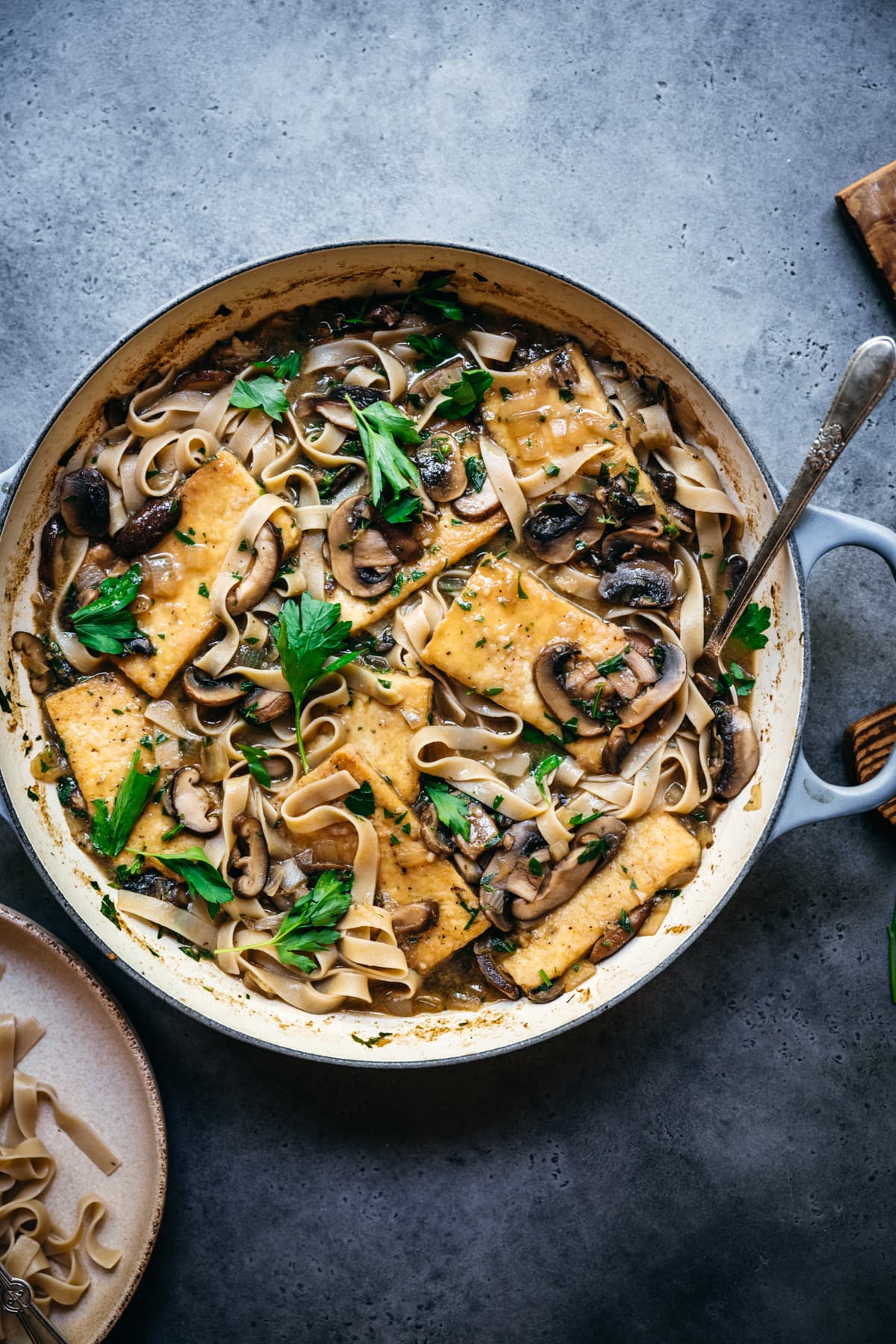 overhead view of vegan tofu marsala in a large pan.