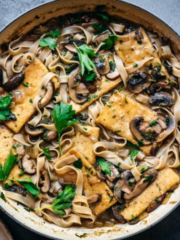 overhead view of vegan tofu marsala in a large pan.