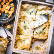 overhead view of pan of vegan butternut squash lasagna cut into slices.