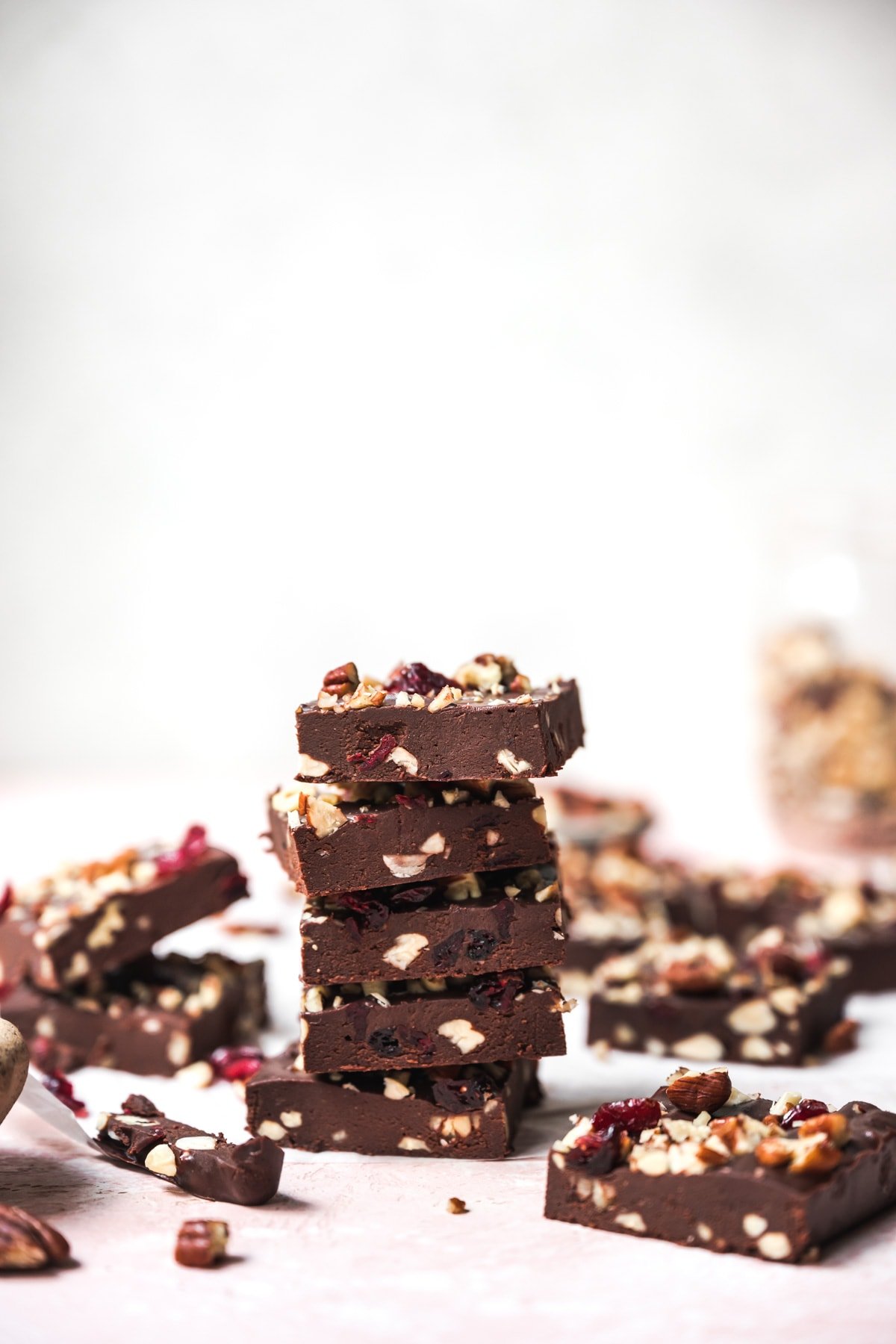 side view of a stack of vegan cranberry nut fudge. 