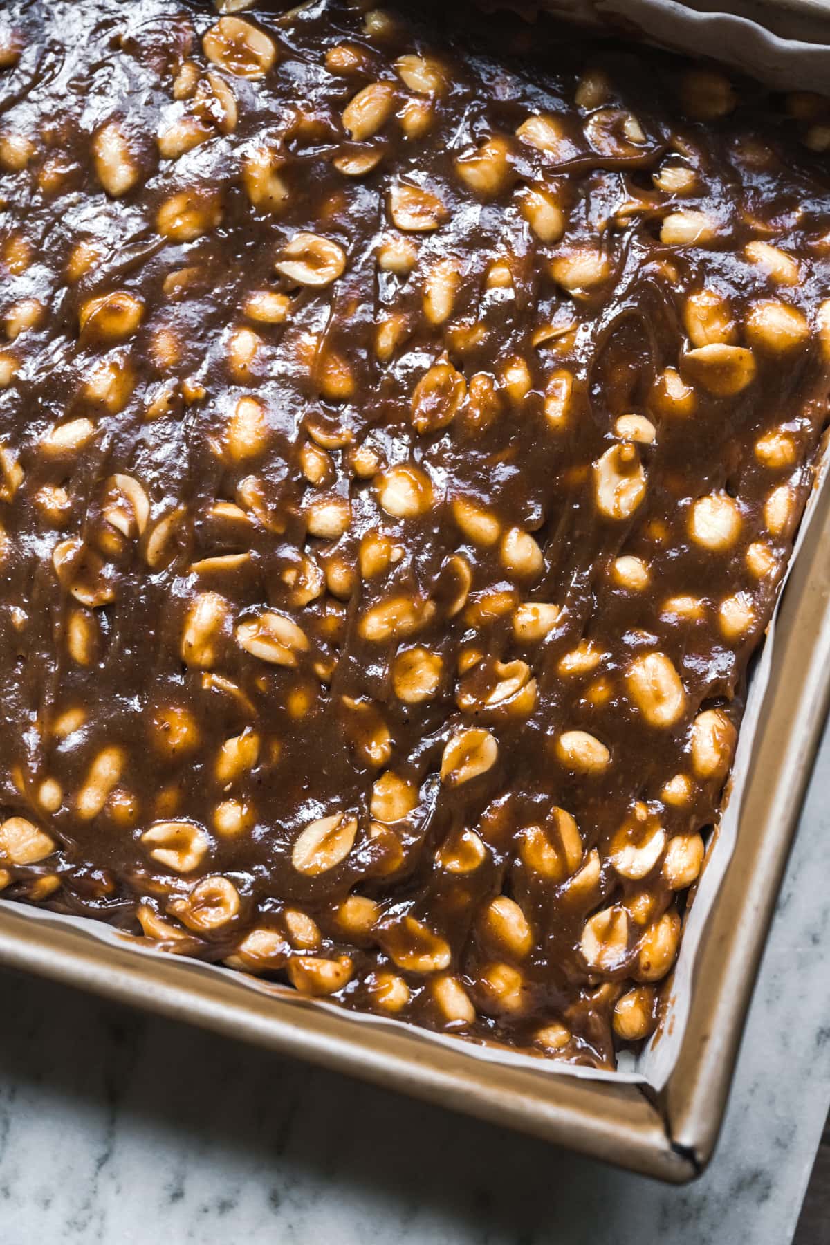 close up view of peanut caramel in a pan.