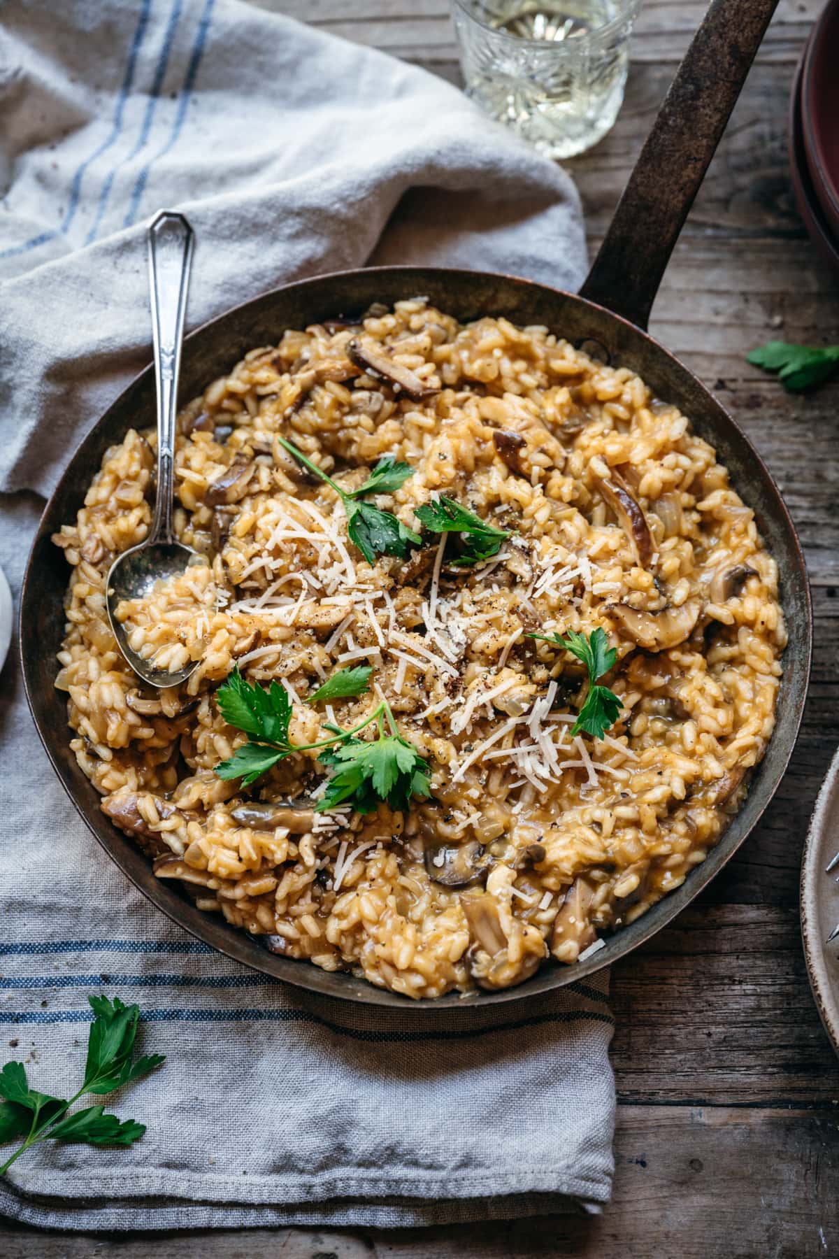 overhead view of vegan mushroom risotto in copper pan.