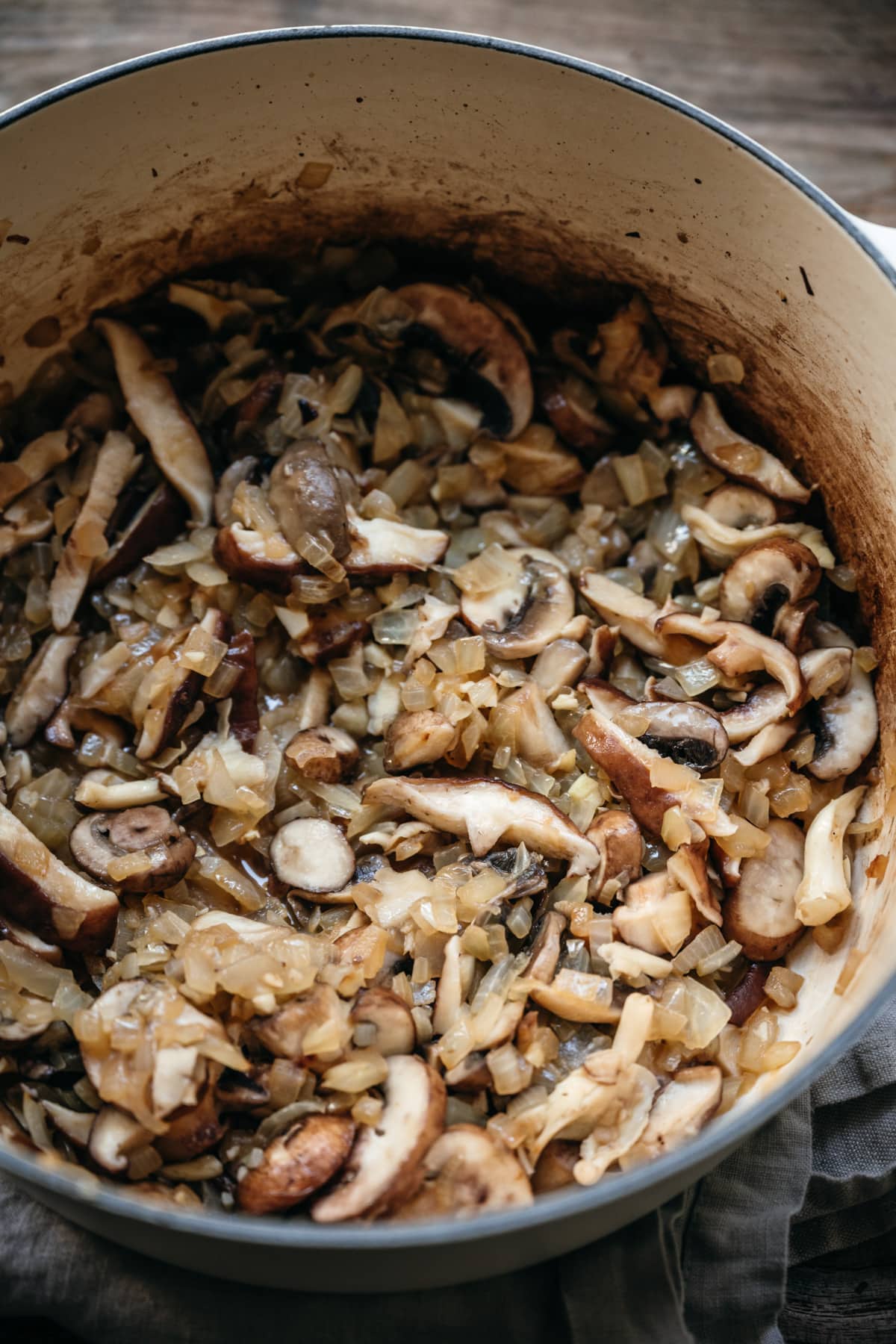 mushrooms and onions in a large pot.