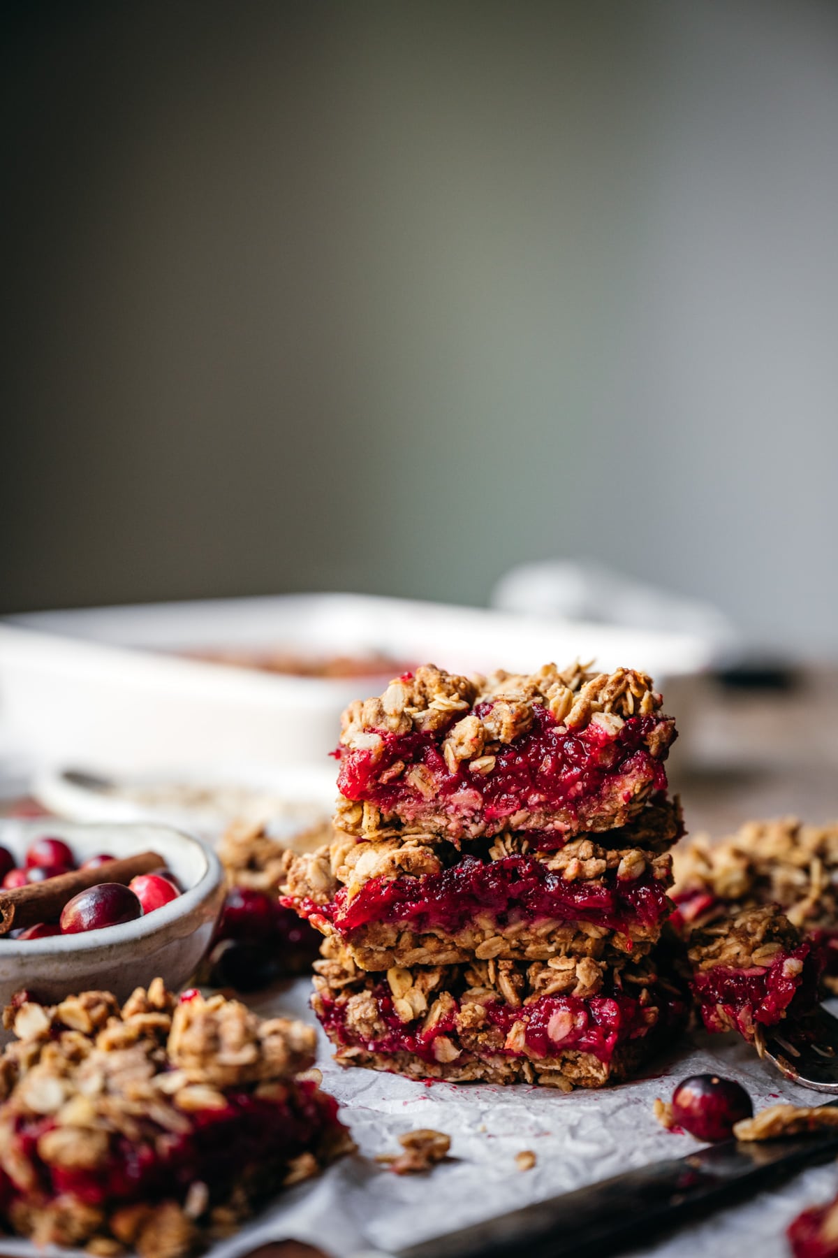 side view of stack of 3 cranberry crumb bars. 