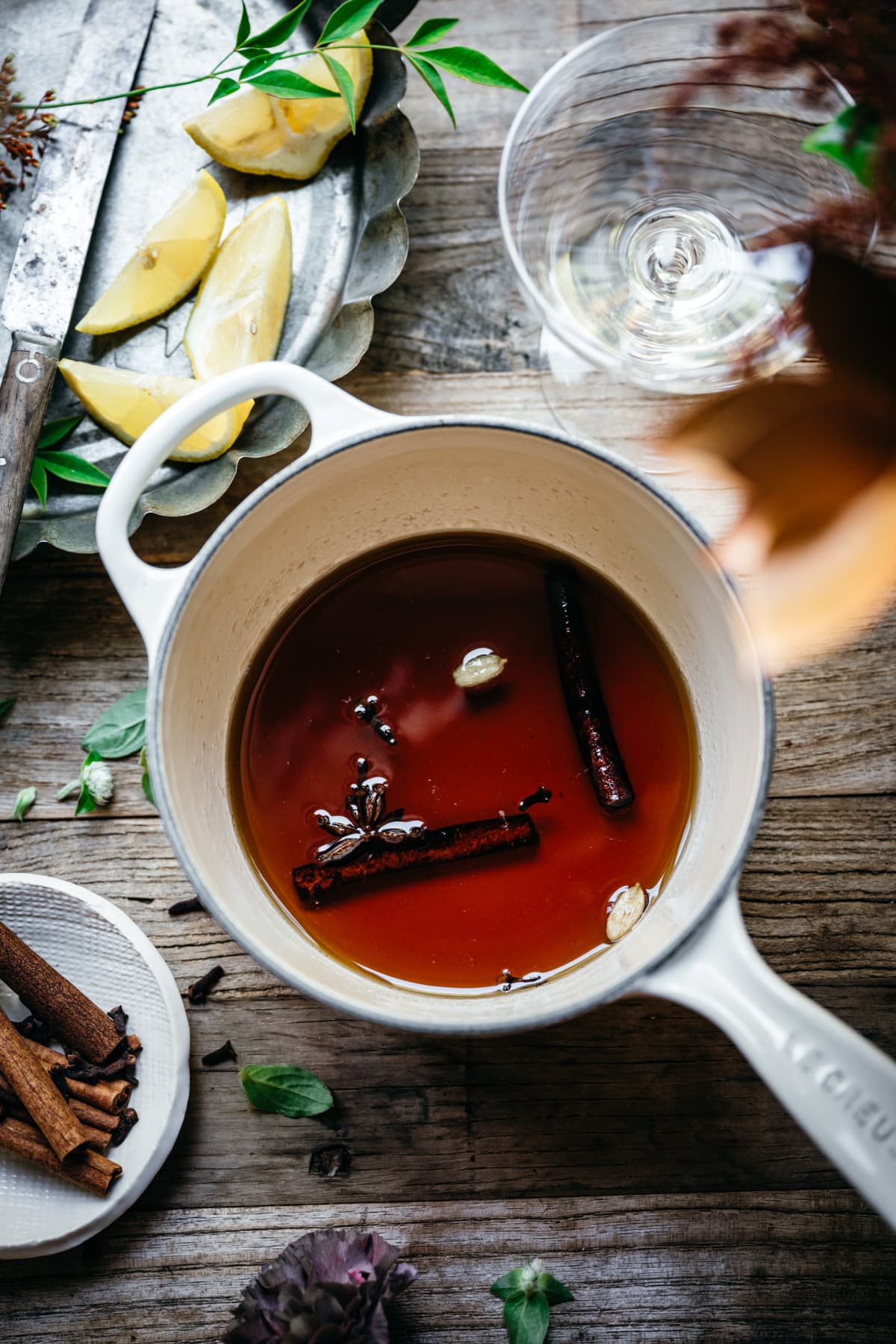 overhead view of maple-spiced simple syrup in a small saucepan.