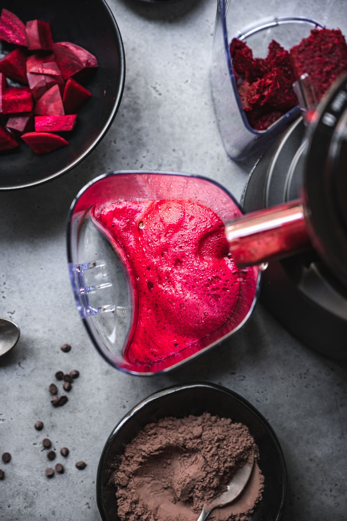 beet juice coming out of juicer.