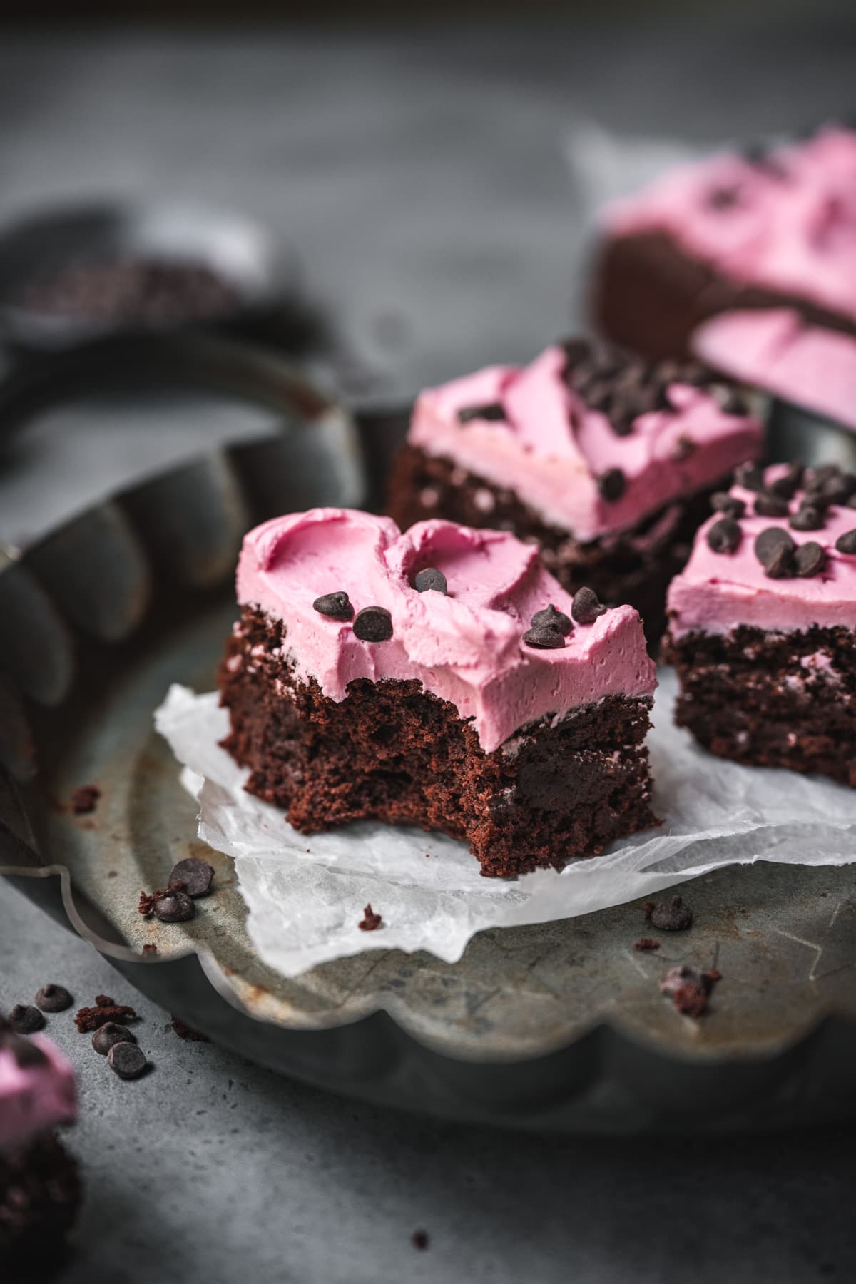 side view of beet brownie with pink frosting.