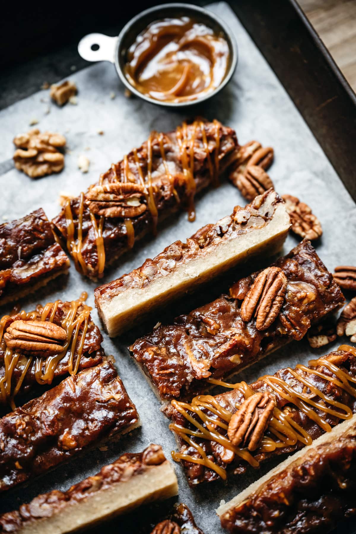 side view of vegan maple bourbon pecan pie bars. 