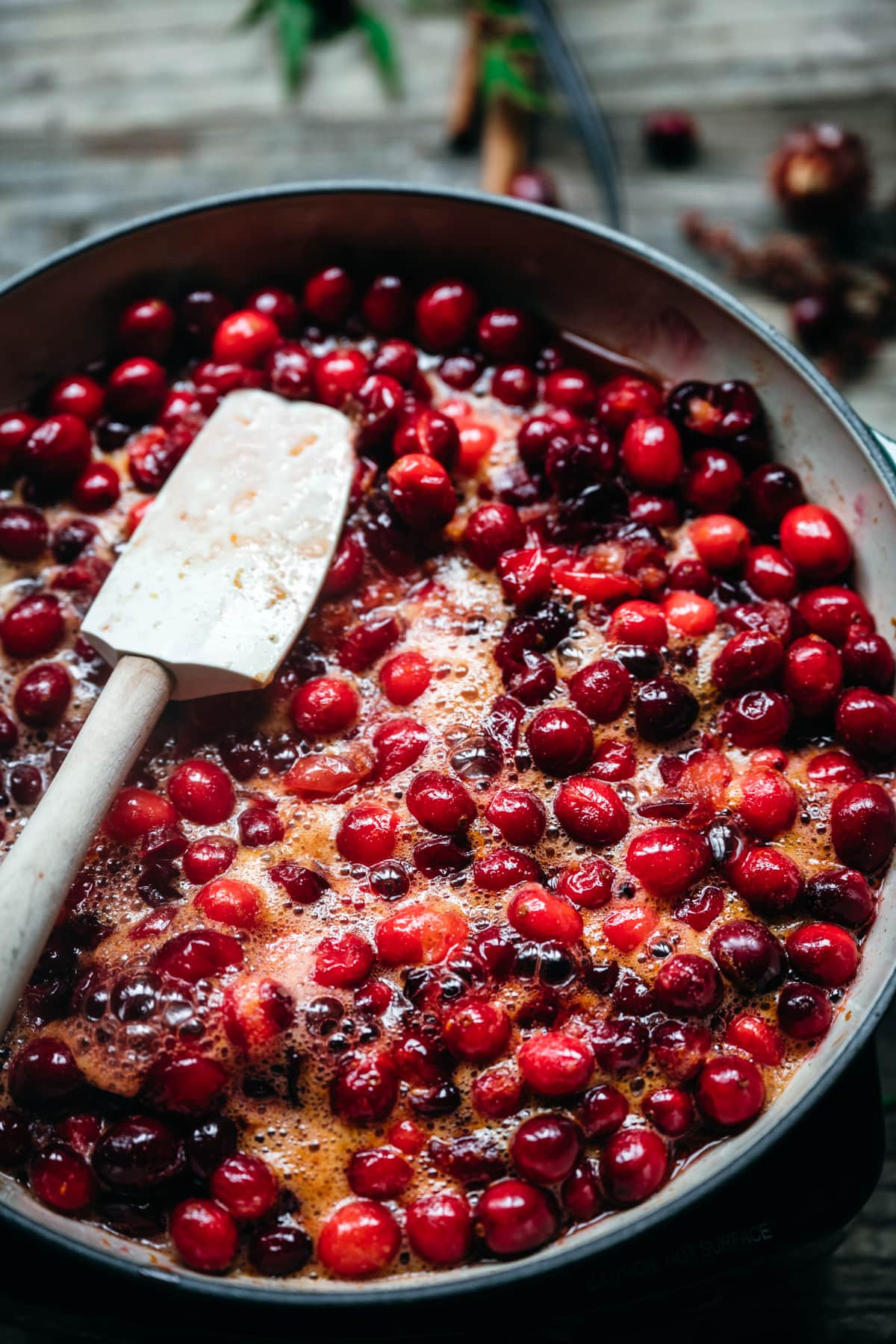 cranberry sauce cooking in a pot.