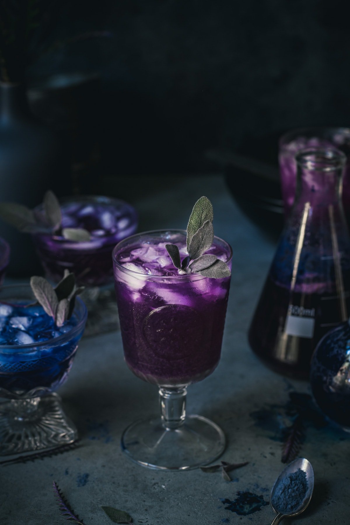 side view of a purple polyjuice potion cocktail in a glass.