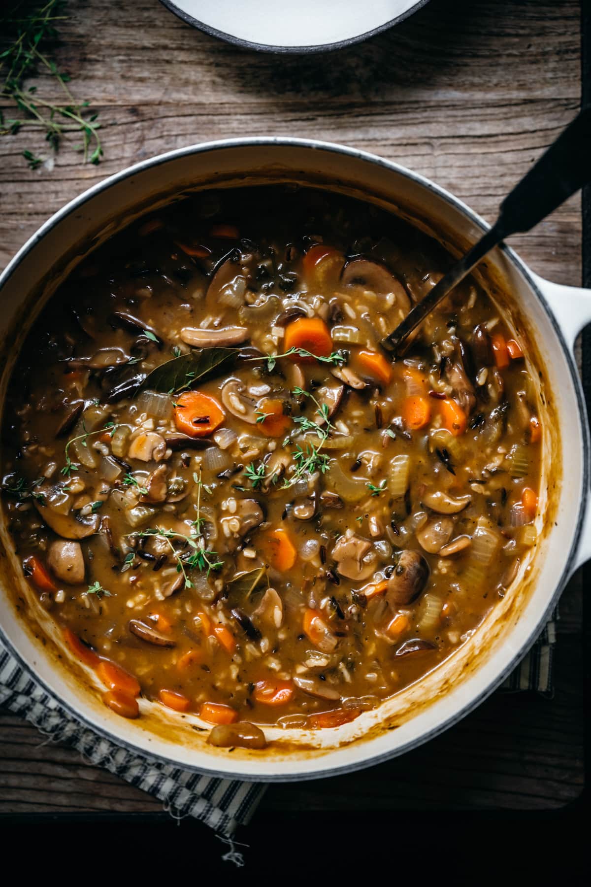 overhead close up view of wild rice mushroom soup in a pot. 