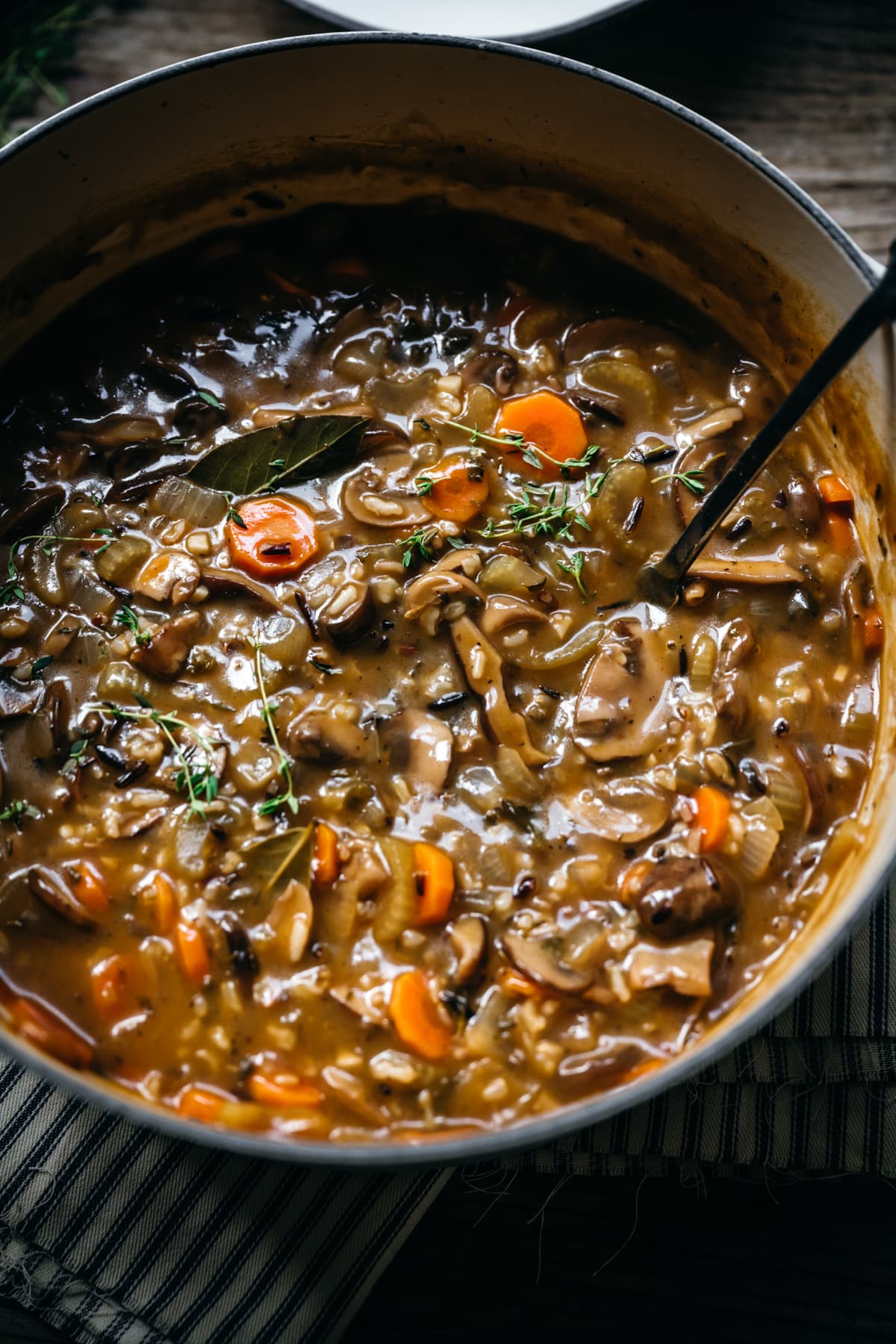 close up view of wild rice mushroom soup in a pot. 