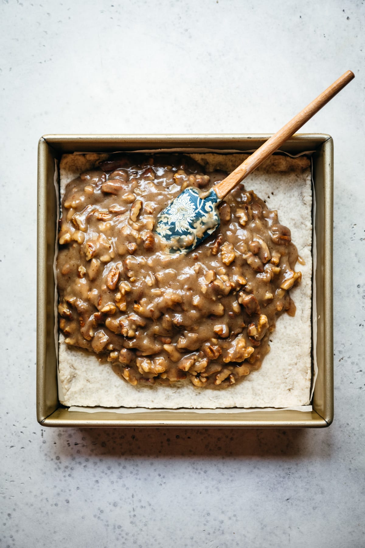 pecan bourbon pie filling spread over shortbread crust.