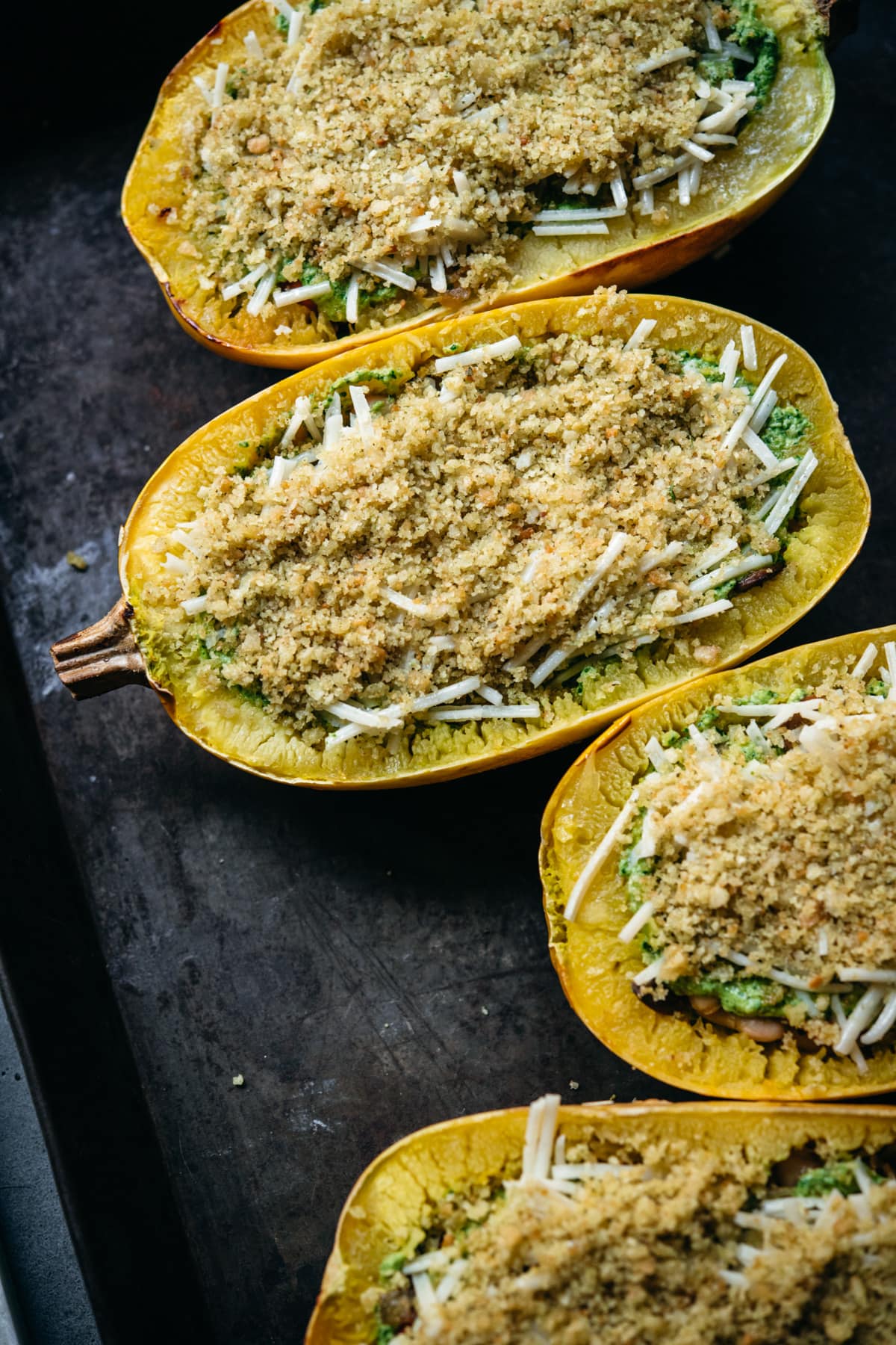 spaghetti squash topped with cheese and breadcrumbs.