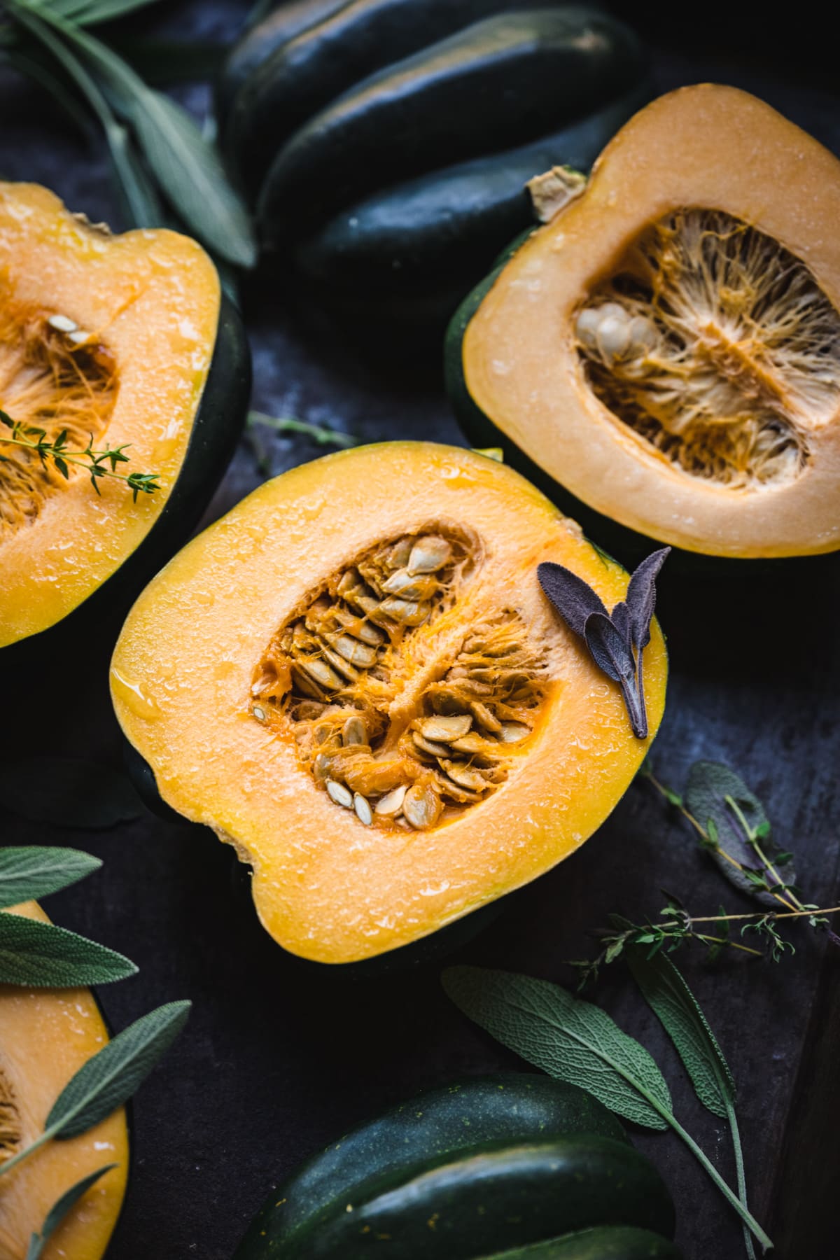 close up view of acorn squash sliced in half. 