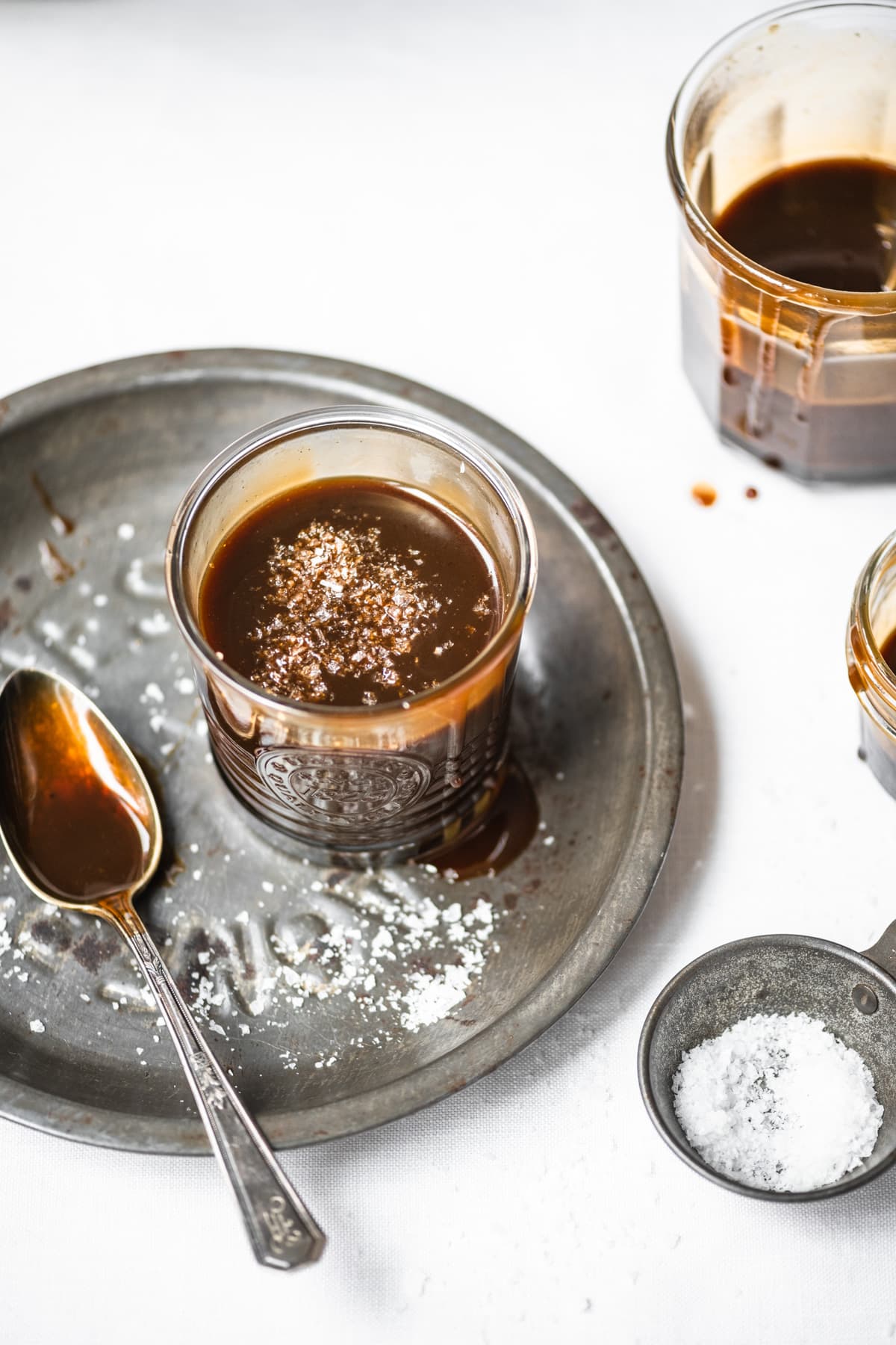 close up view of vegan salted caramel in a glass jar. 