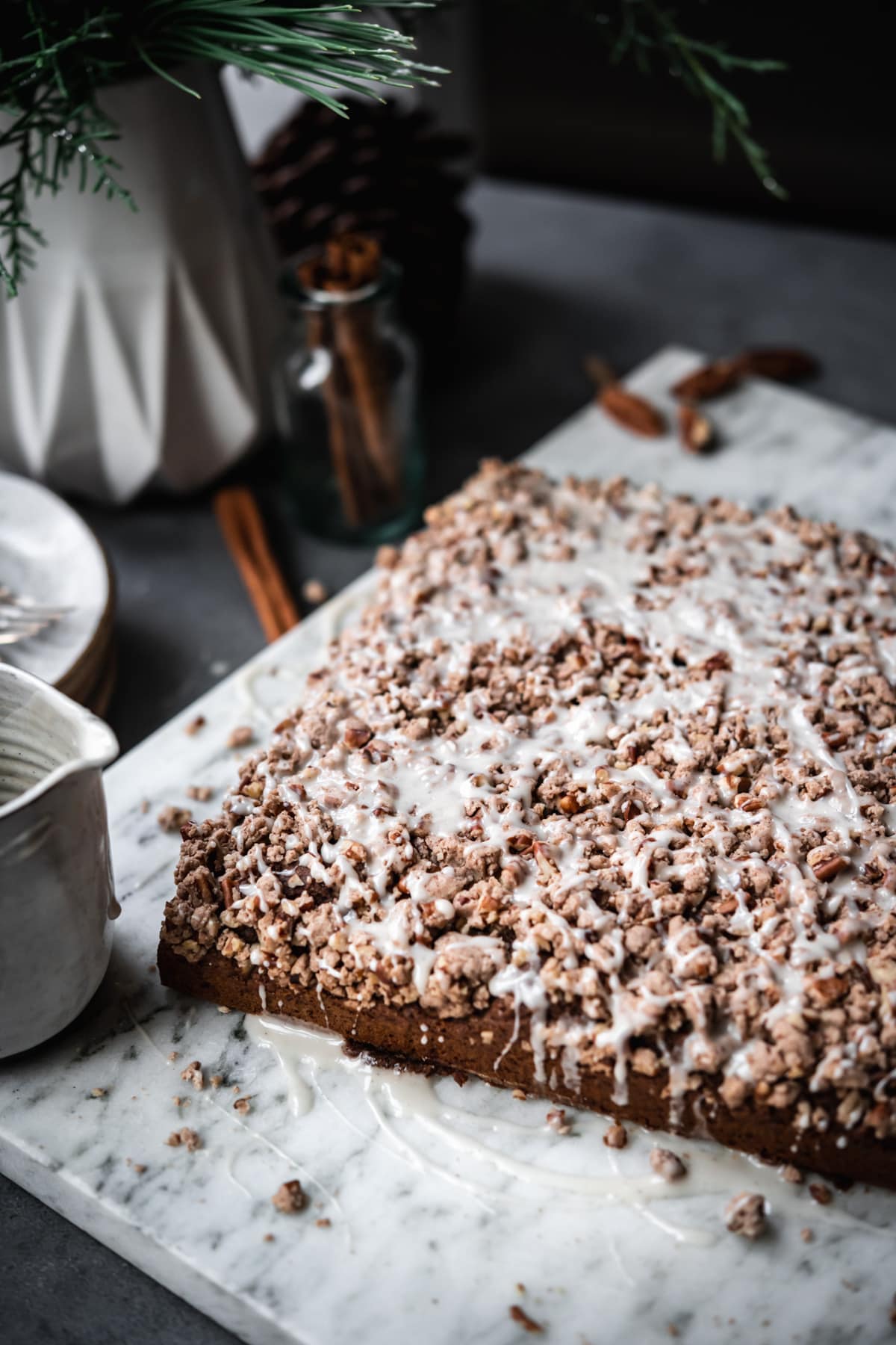 side view of  gingerbread coffee cake with streusel topping. 