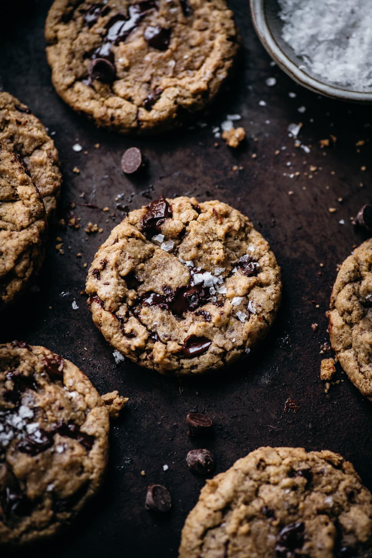 overhead view of vegan and gluten free chocolate chip cookies on sheet pan. 